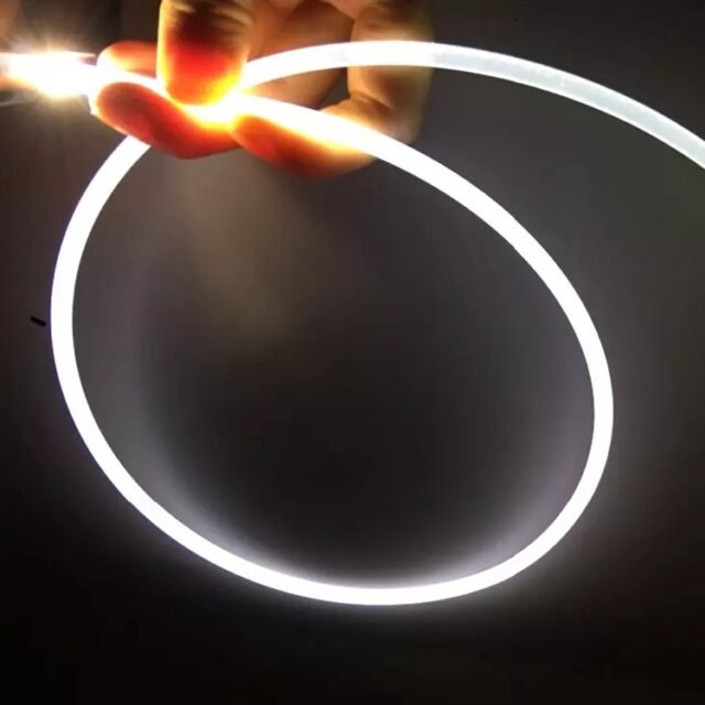 Hand holding bright white glowing 4mm side-glow PMMA fiber