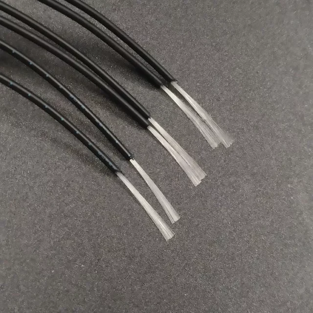 Black PE-jacketed Asahi POF cables stripped back to clear PMMA fibers
