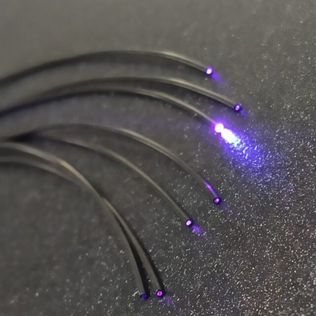 Close-up of thin black PE jacketed fiber