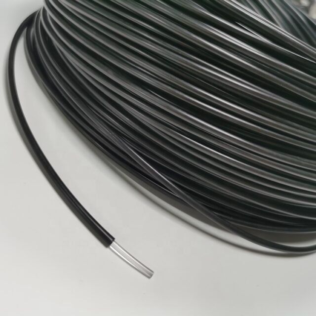 Coiled black PE POF cable with one end stripped to clear PMMA fibre