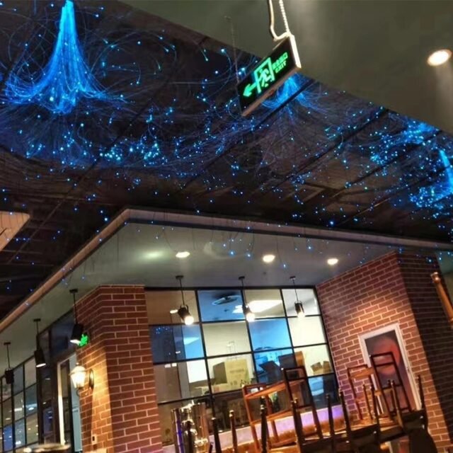 Restaurant ceiling installed with blue fiber-optic star curtain made from black light-guide fiber