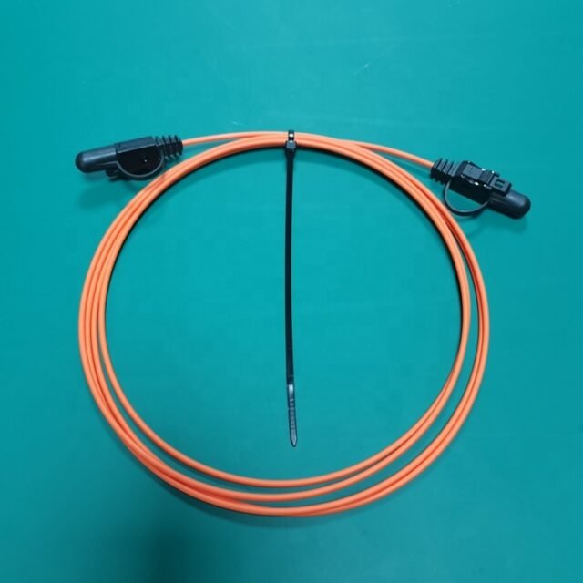 Coiled orange CA7103 HCS duplex patch cord with two black JIS F07 connectors