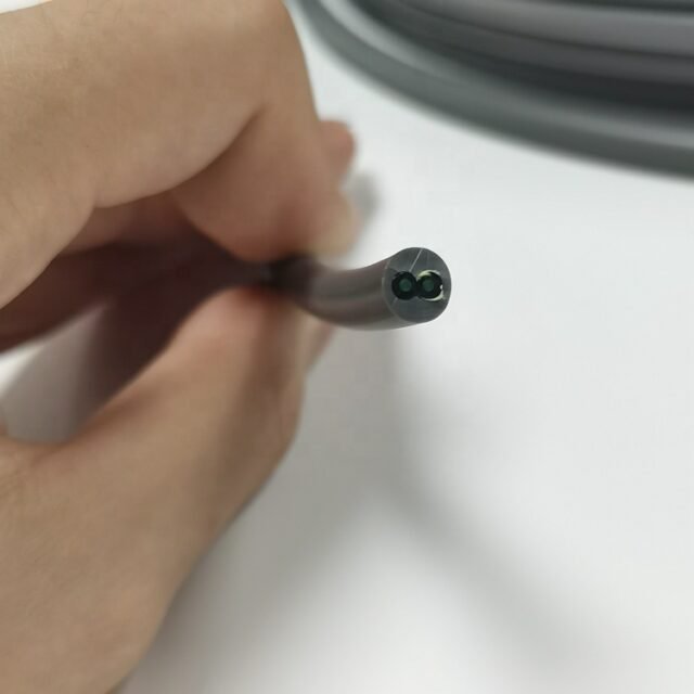 Cross-section of armored dual-core POF cable showing two PMMA fibers and Kevlar strength members