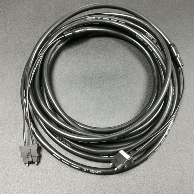 Coiled black A66L-6001-0026#L5R H-PCF duplex cable with two JIS F07 connectors, OKI DENSEN jacket