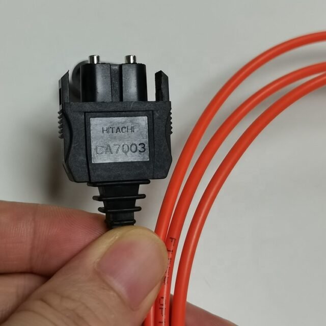Close-up of black MITSUBISHI CA7003 JIS F07 connector on orange H-PCF duplex cord