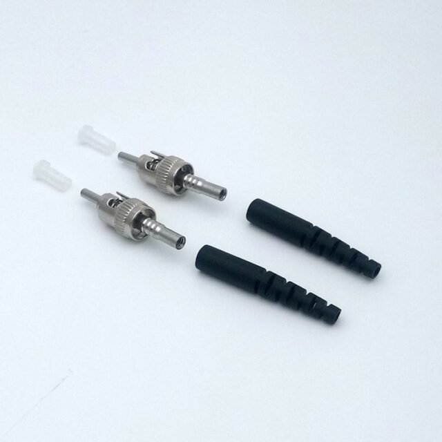 Two metal HPCS-ST connectors with black boots and dust caps