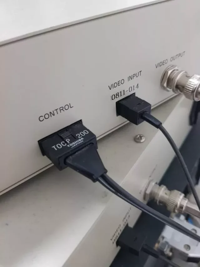 TOCP200 cable plugged into VIDEO INPUT and CONTROL ports on a CCTV monitor controller