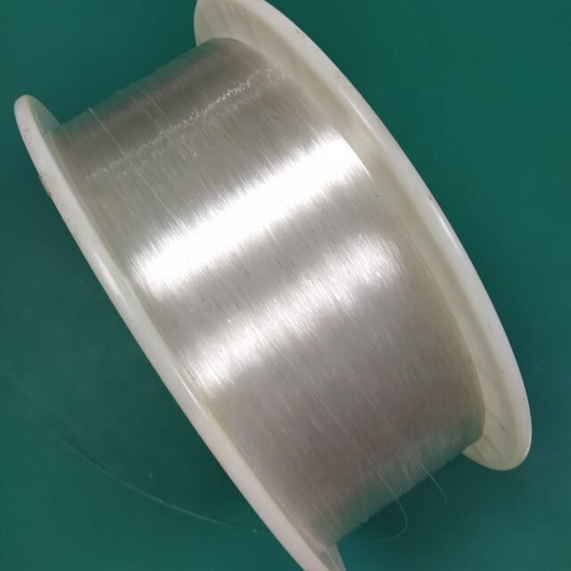 Tight coil of clear 0.5mm bare PMMA fiber