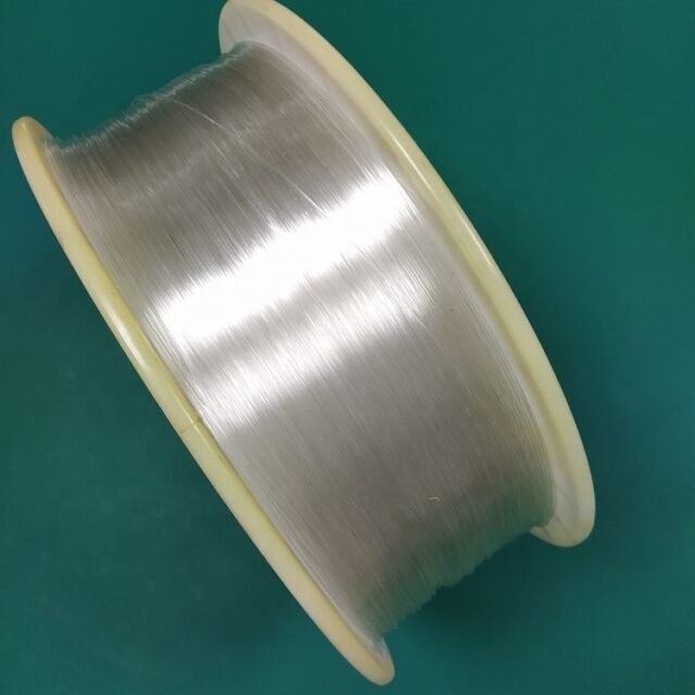 Clear 0.75mm PMMA fibre wound on a white plastic spool