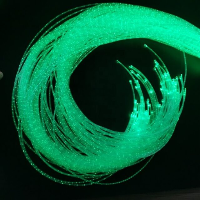 Green sparkle fiber bundle glowing in a coil