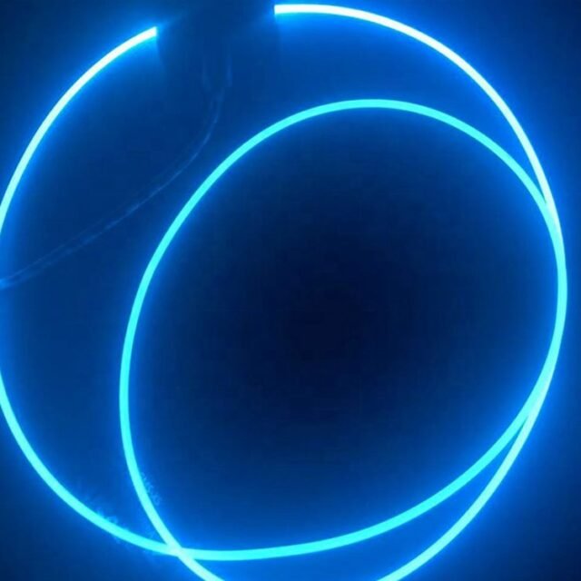 Coiled blue side-glow PMMA fiber glowing in the dark