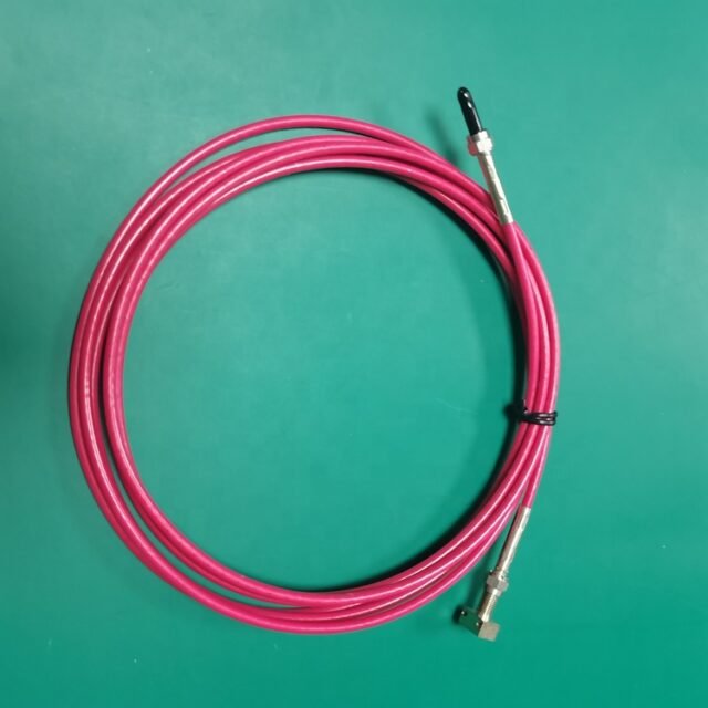Red SMA905 probe POF jumper coiled