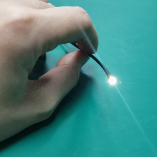 Looped black sensor fiber optic jumper cable