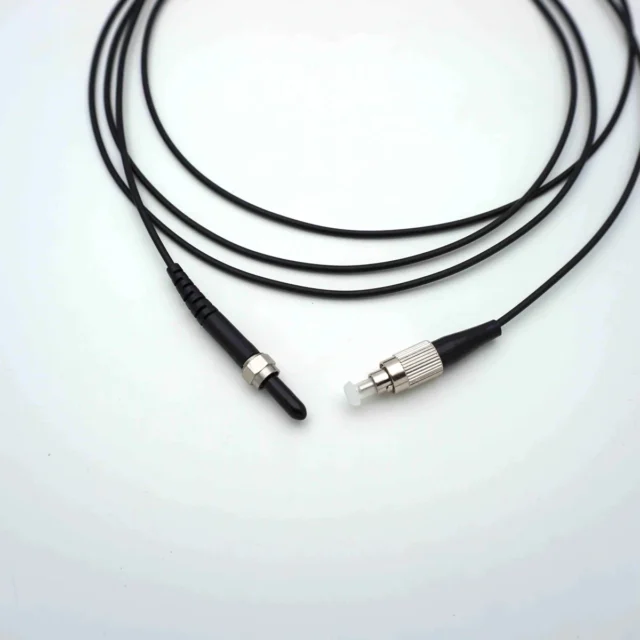 Black SMA905-to-FC PMMA POF jumper, both ends visible