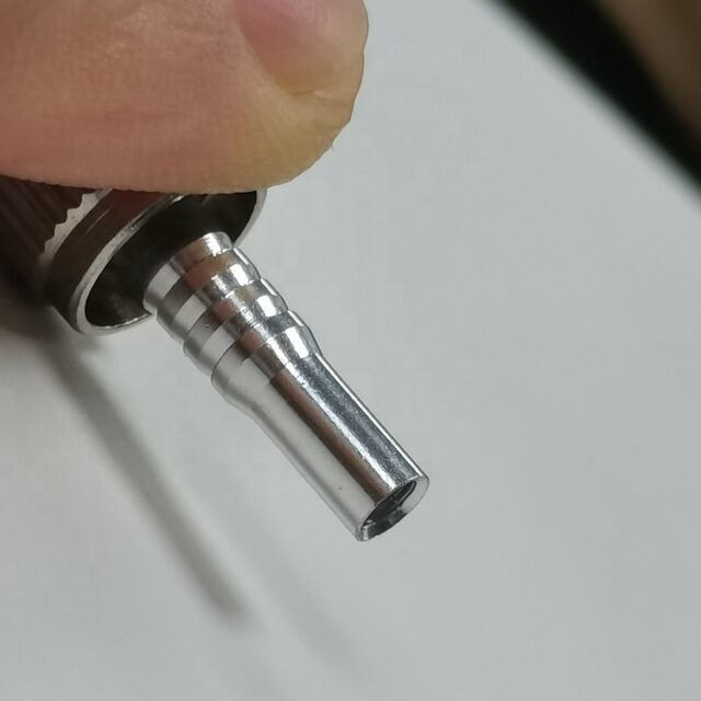 Metal ST (BFOC) connector with black boot on white background