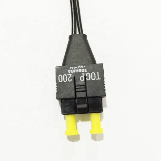 Toshiba TOCP200 connector close-up with yellow dust caps