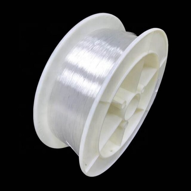 Clear Toray large-core PMMA POF wound on a white spool, black background