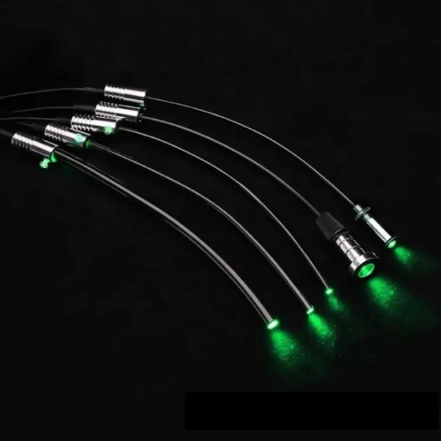 Black light-guide fibers with metal end fittings glowing green