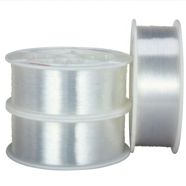 Clear PMMA lighting fibre on white plastic spools